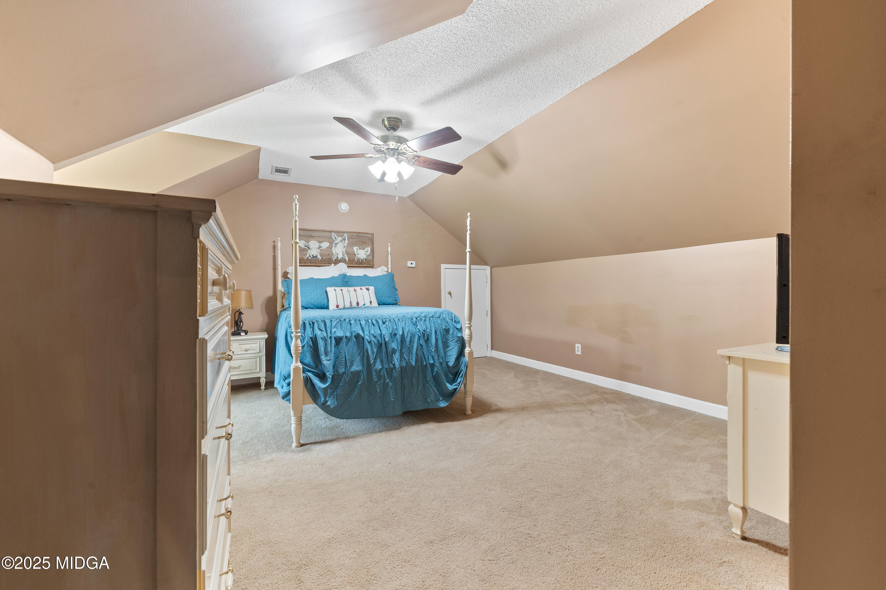 299 Colvin Road Forsyth, GA 31029 - Photo 28 of 51 a living room with furniture and a chandelier