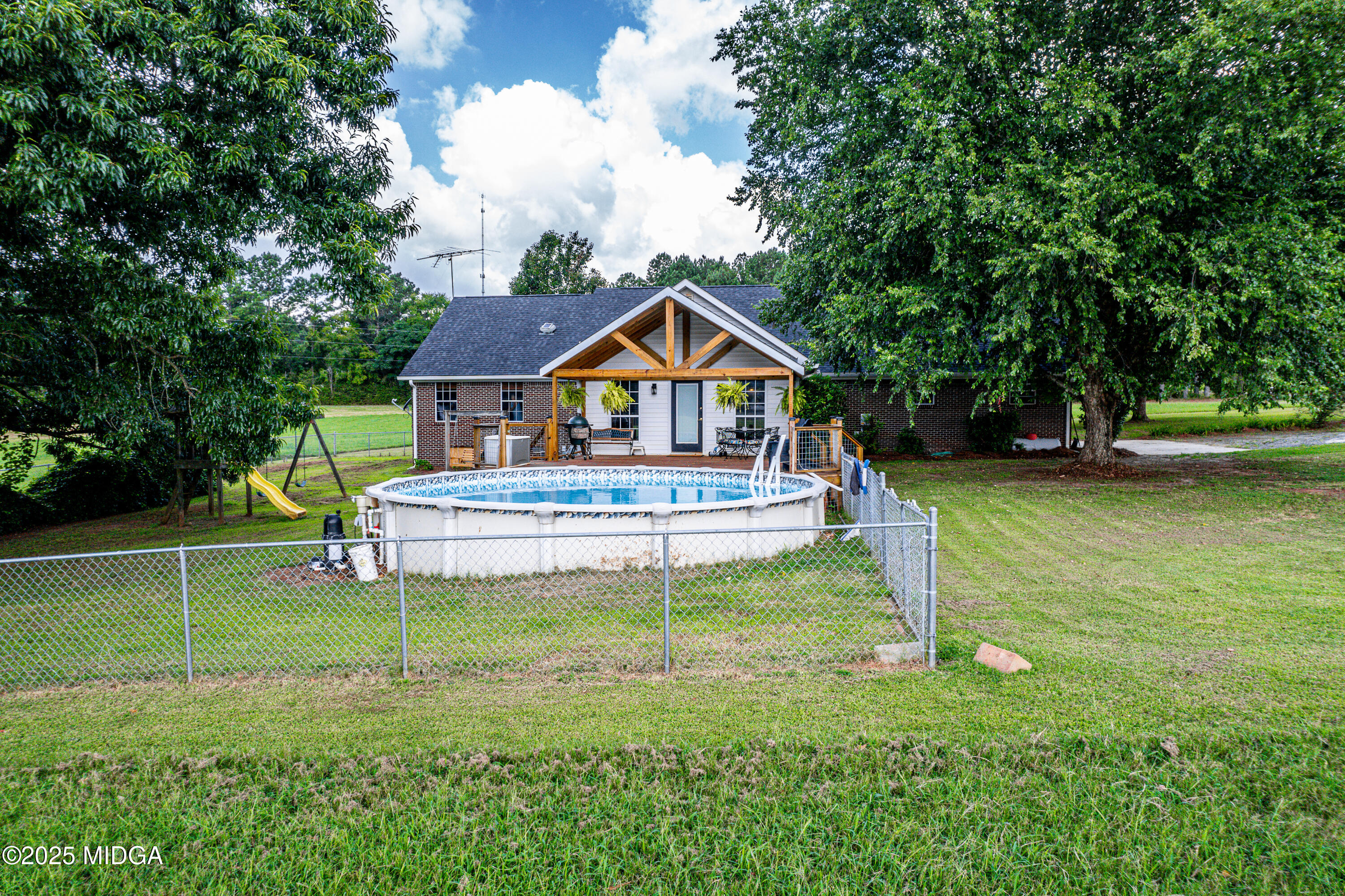 299 Colvin Road Forsyth, GA 31029 - Photo 33 of 51 a front view of a house with a yard table and chairs