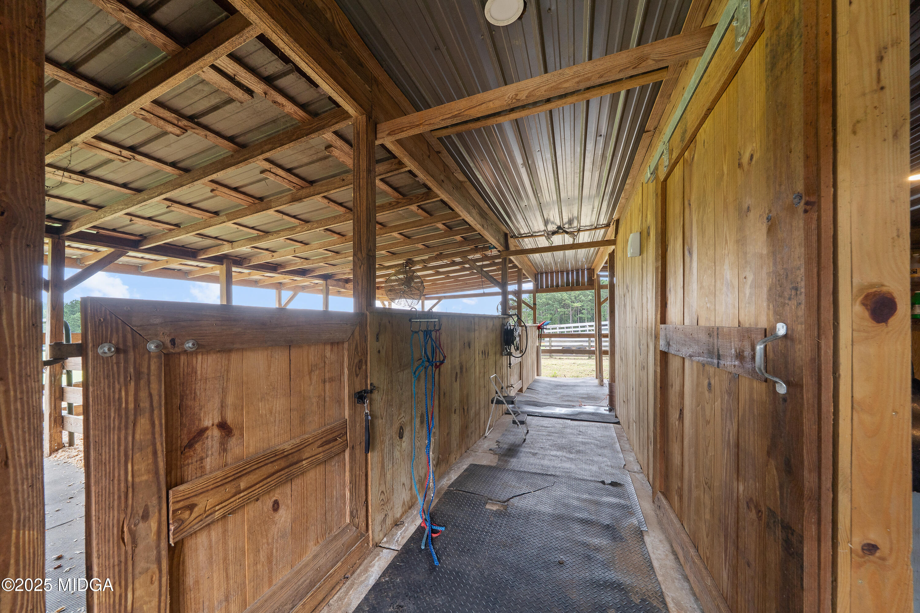 299 Colvin Road Forsyth, GA 31029 - Photo 38 of 51 a view of a porch with a shower and wooden door