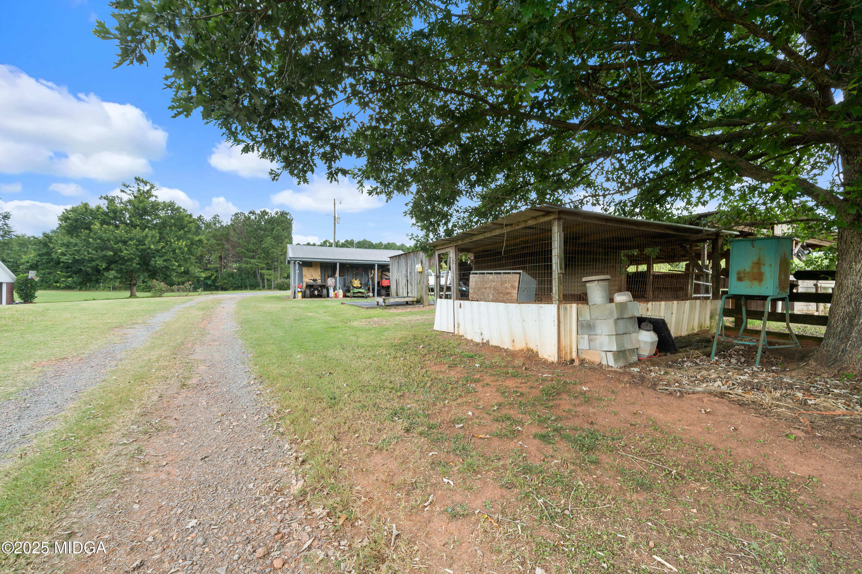 299 Colvin Road Forsyth, GA 31029 - Photo 42 of 51 a view of a house with backyard and sitting area
