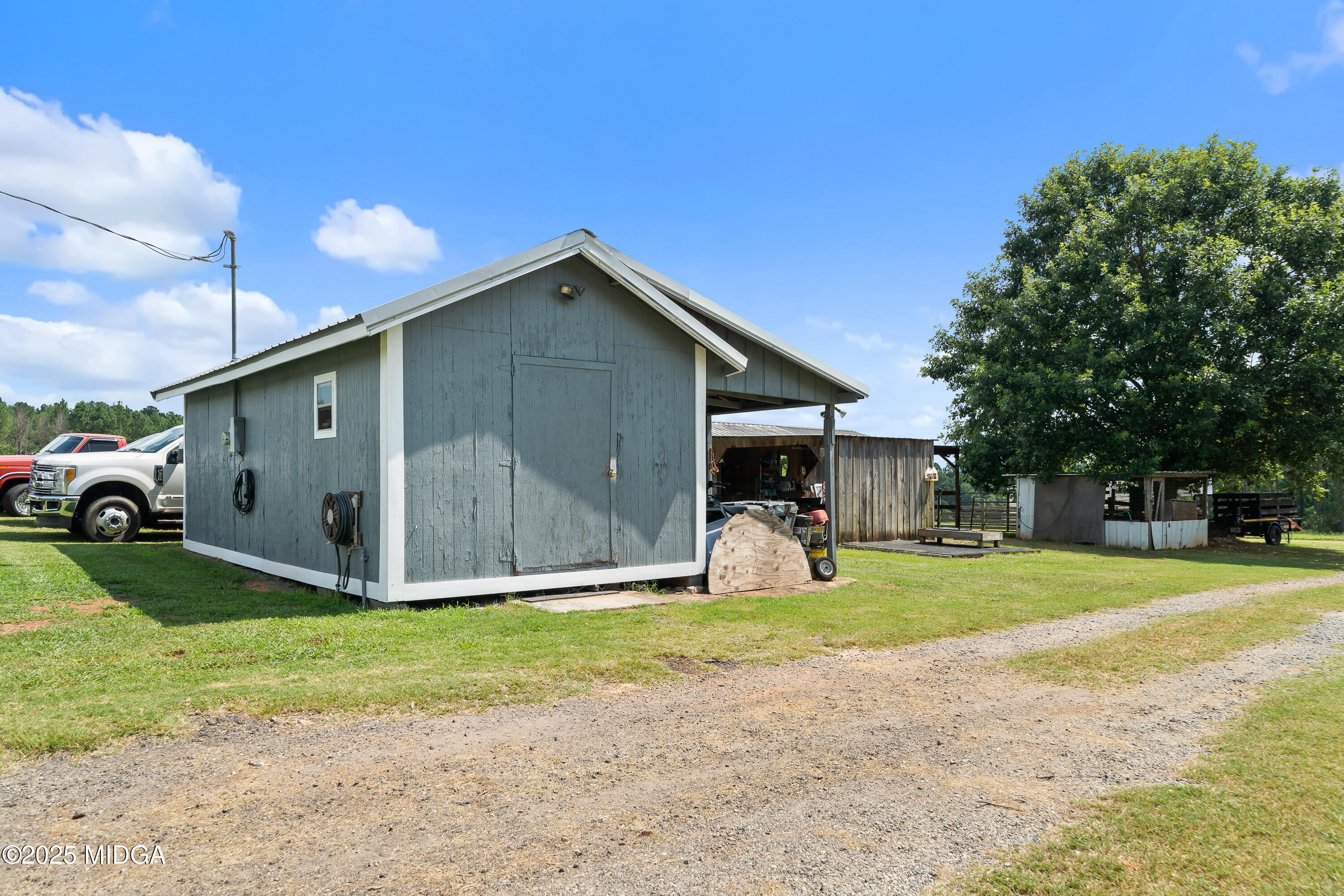 299 Colvin Road Forsyth, GA 31029 - Photo 43 of 51 a front view of a house with a yard and garage