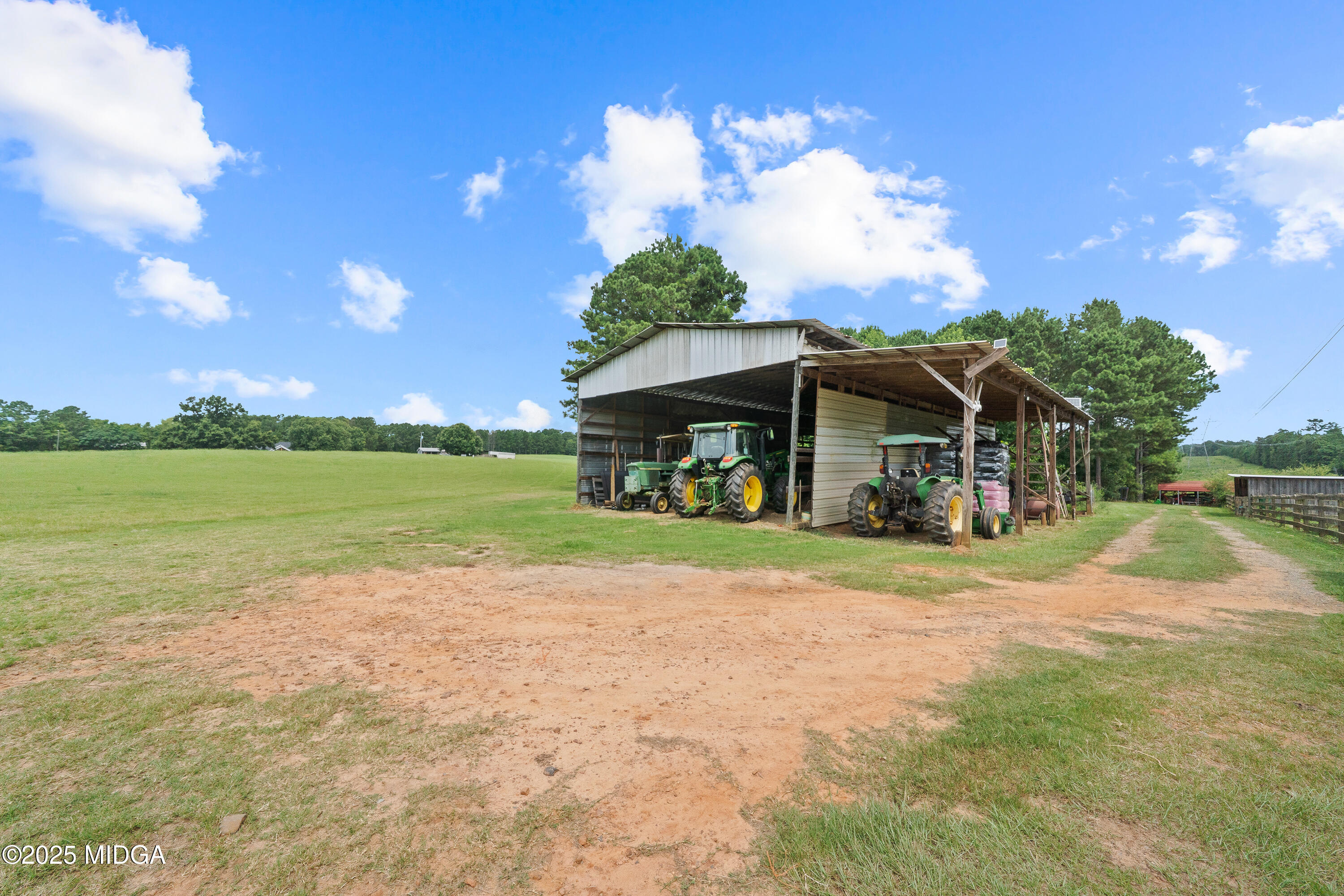 299 Colvin Road Forsyth, GA 31029 - Photo 46 of 51 a view of a house with a yard and potted plants
