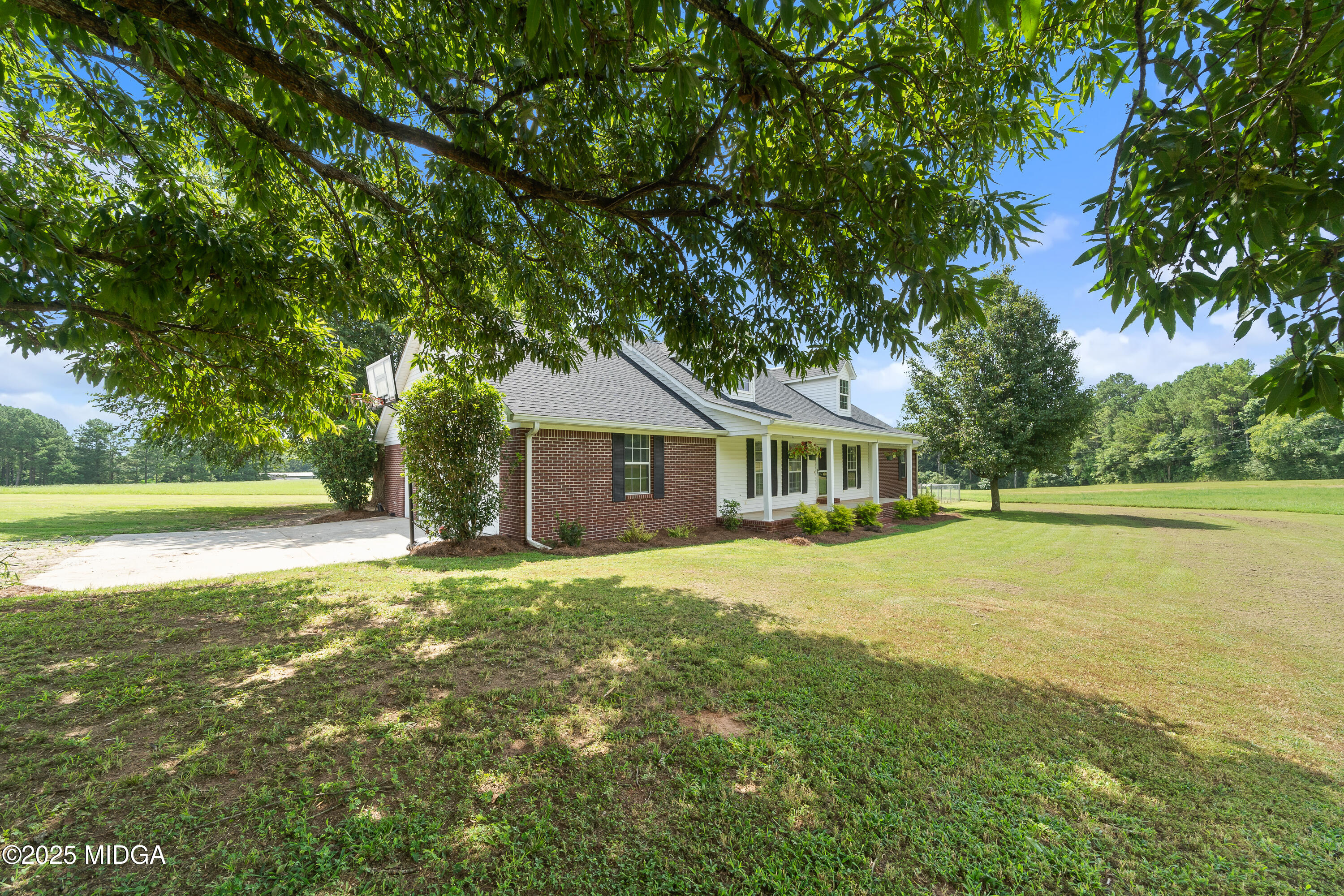 299 Colvin Road Forsyth, GA 31029 - Photo 48 of 51 a front view of a house with yard and green space