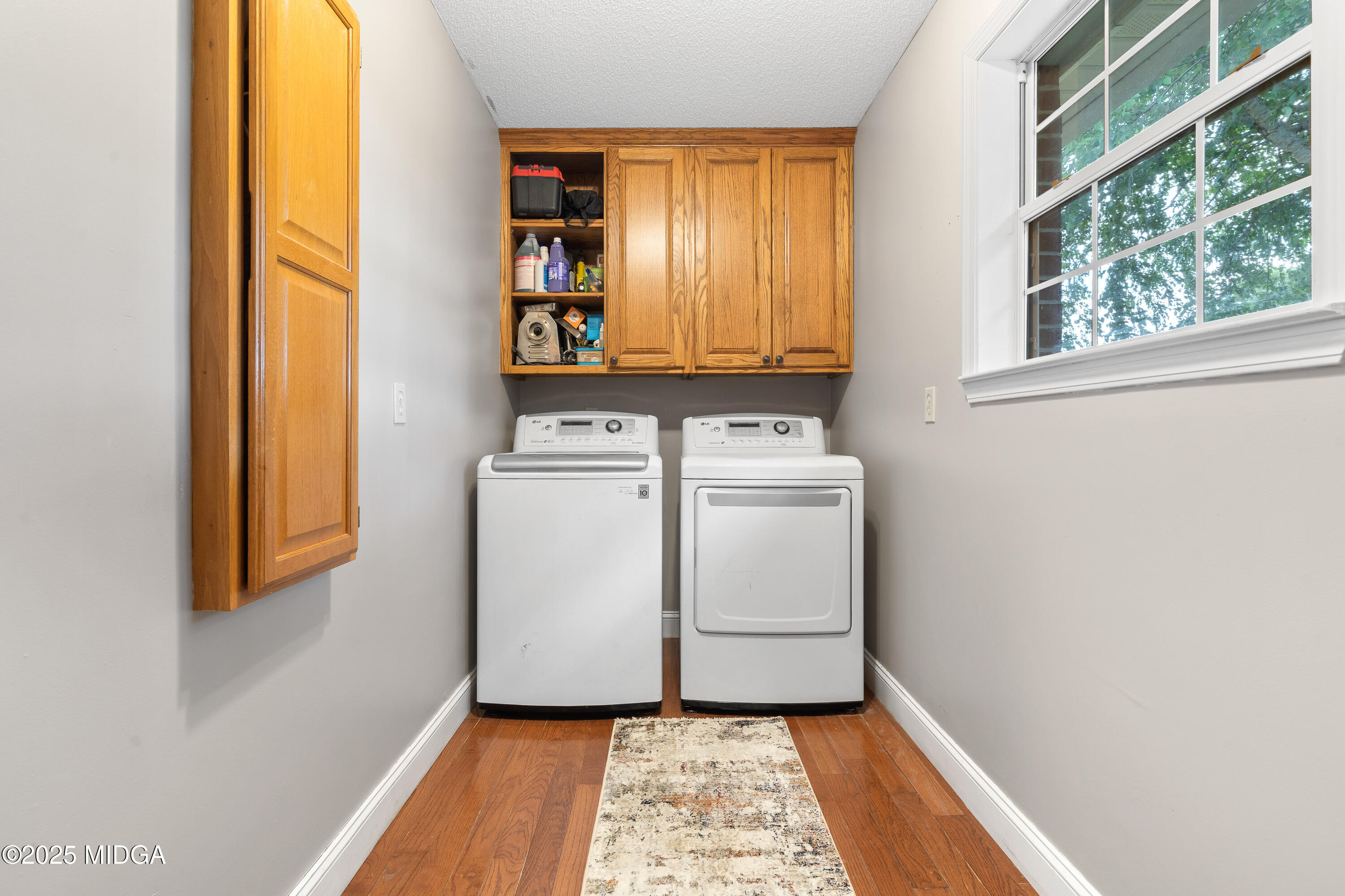 299 Colvin Road Forsyth, GA 31029 - Photo 50 of 51 a utility room with dryer and washer