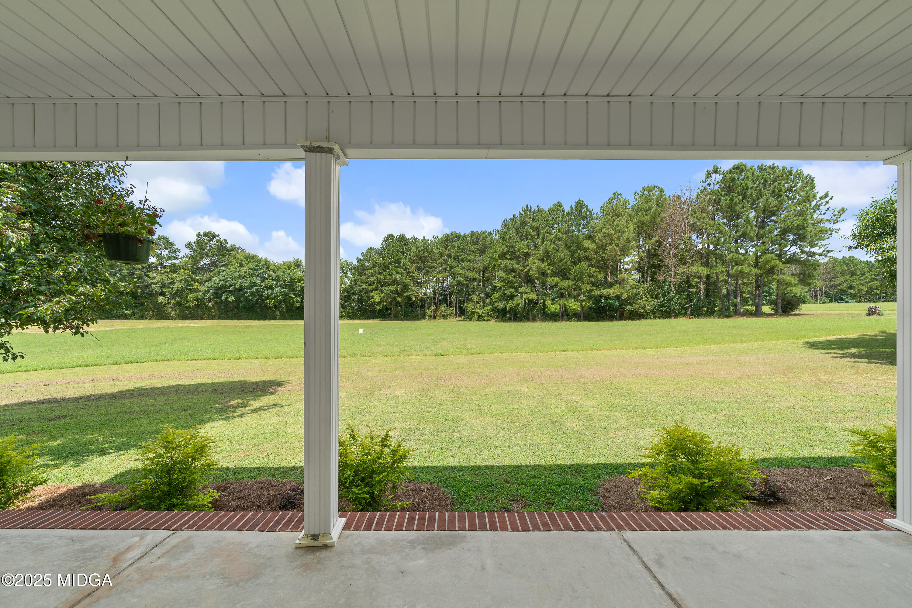 299 Colvin Road Forsyth, GA 31029 - Photo 5 of 51 a view of a swimming pool with a lawn chairs and next to yard