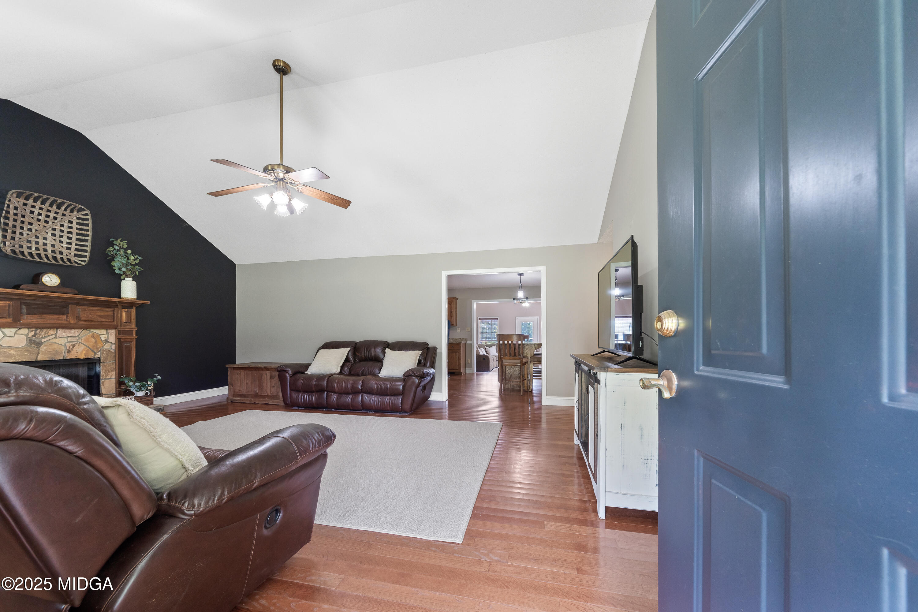 299 Colvin Road Forsyth, GA 31029 - Photo 6 of 51 a living room with furniture and chandelier