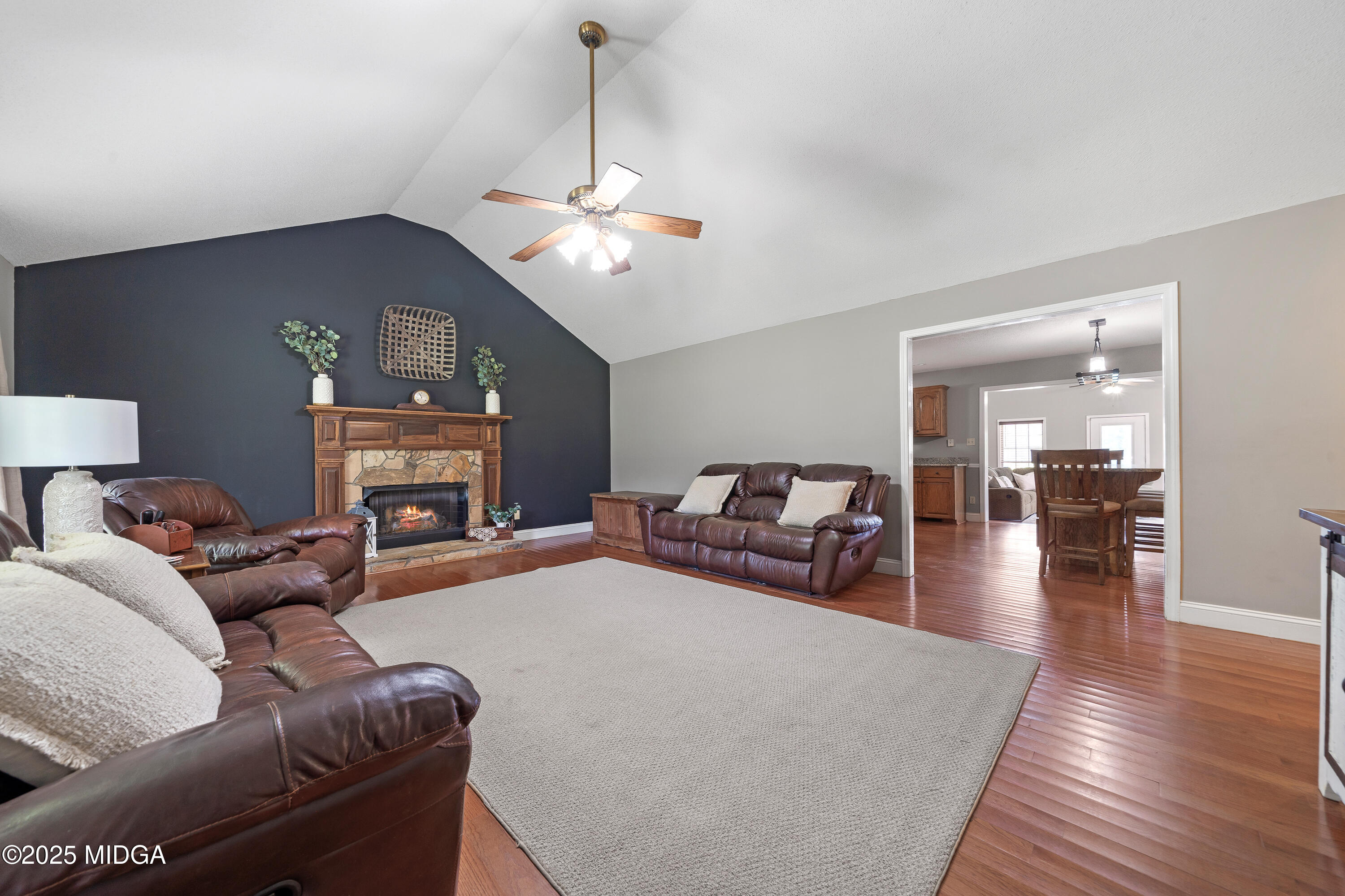 299 Colvin Road Forsyth, GA 31029 - Photo 7 of 51 a living room with furniture and a chandelier