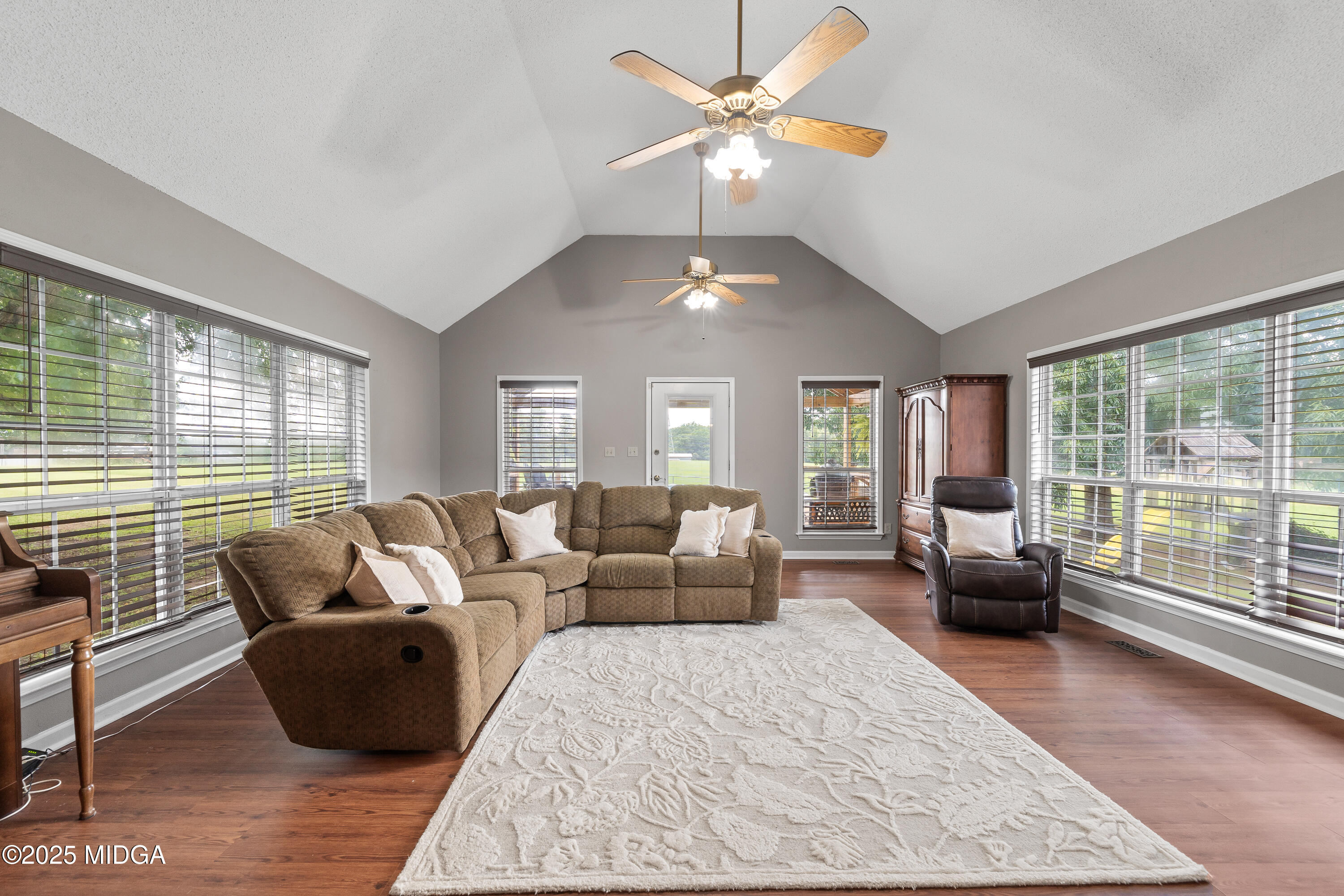 299 Colvin Road Forsyth, GA 31029 - Photo 8 of 51 a living room with furniture and a large window