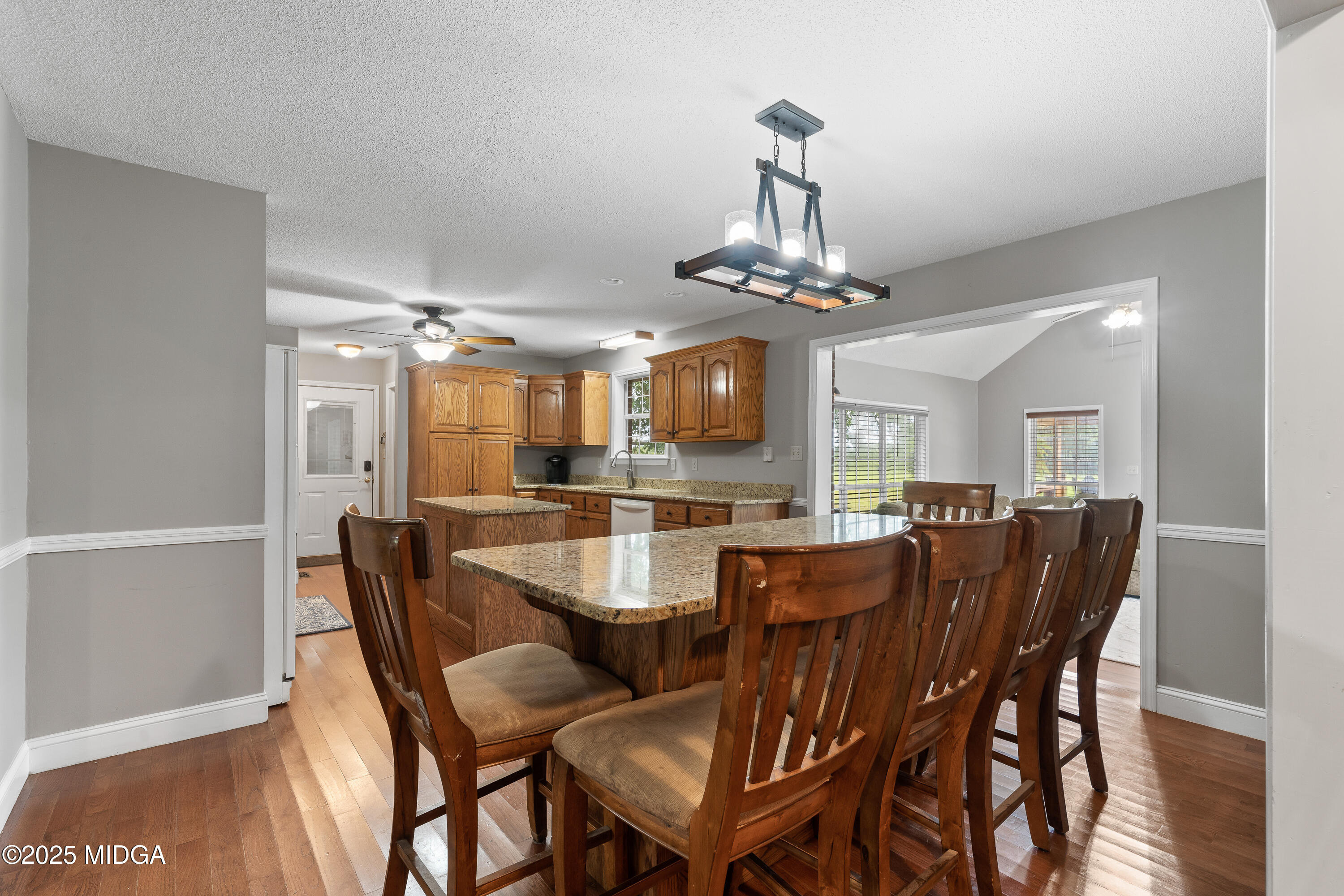 299 Colvin Road Forsyth, GA 31029 - Photo 10 of 51 a view of a dining room with furniture and chandelier