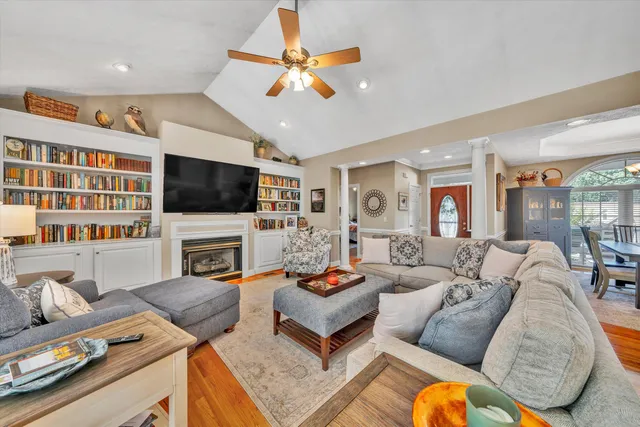 a living room with furniture fireplace and a flat screen tv