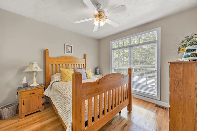 a bedroom with furniture and a window