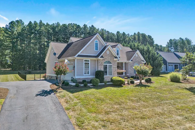 a front view of a house with garden