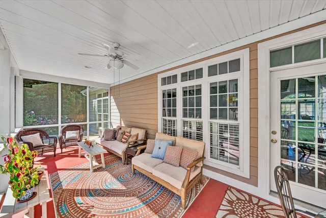 a living room with furniture and a window
