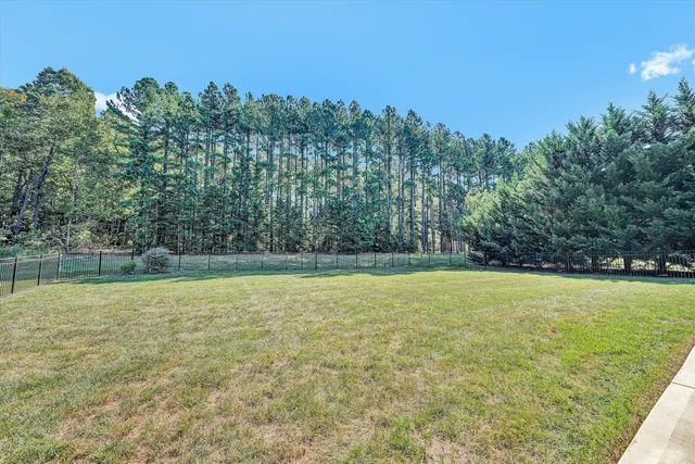 a view of a large pool in a yard