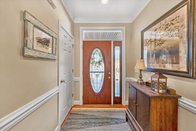 a view of an entryway with wooden floor