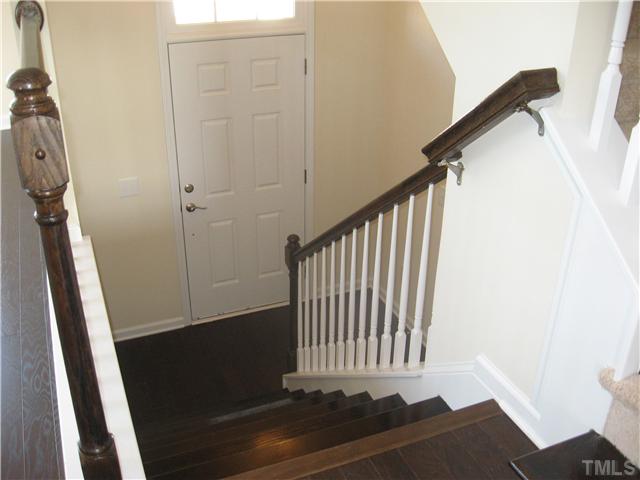 9125 Falkwood Road, Unit 163 Raleigh, NC 27617 - Photo 10 of 23 Hardwood floors and stairs create a warm and inviting first impression.