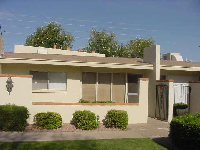 625 South Power Road, Unit 367 Mesa, AZ 85206 - Photo 2 of 4 a front view of a house with garden