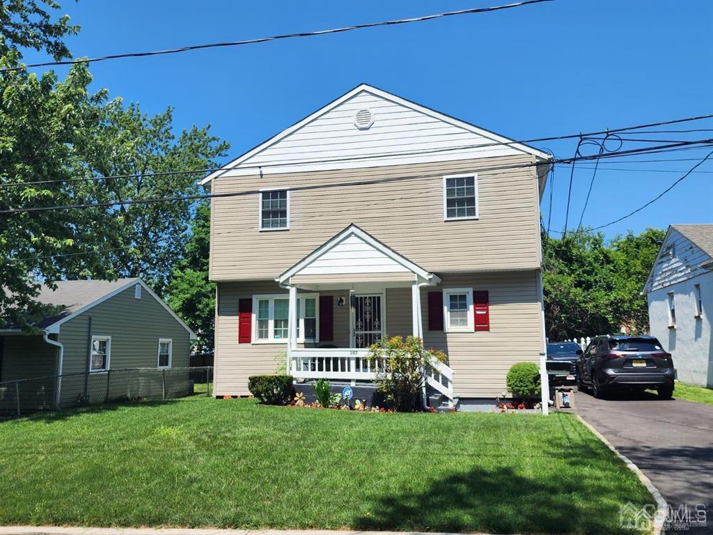 184 Raritan Street Keyport, NJ 07735 - Photo 1 of 24 a front view of a house with a garden
