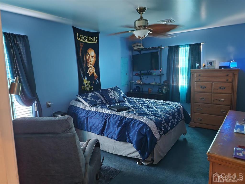 184 Raritan Street Keyport, NJ 07735 - Photo 13 of 24 a bedroom with a bed and a dresser