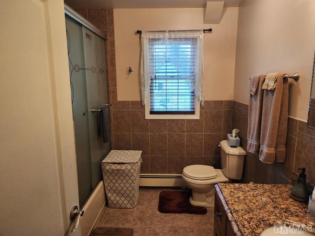 184 Raritan Street Keyport, NJ 07735 - Photo 15 of 24 a bathroom with a toilet and a shower