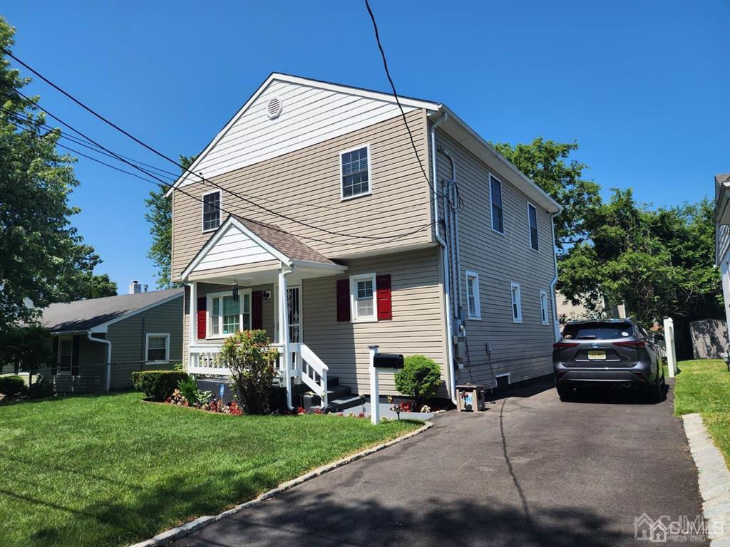 184 Raritan Street Keyport, NJ 07735 - Photo 2 of 24 a front view of a house with a garden