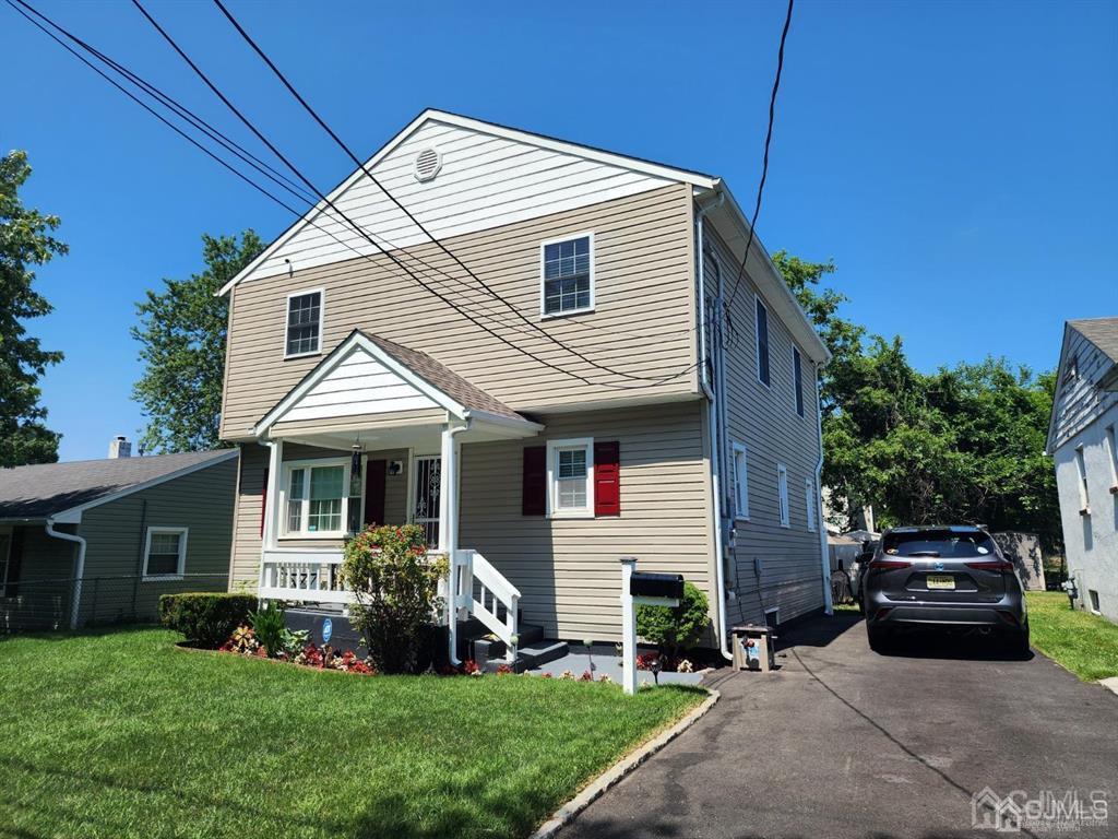 184 Raritan Street Keyport, NJ 07735 - Photo 22 of 24 a front view of a house with a yard