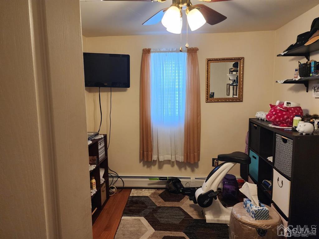 184 Raritan Street Keyport, NJ 07735 - Photo 4 of 24 a room with furniture and flat screen tv