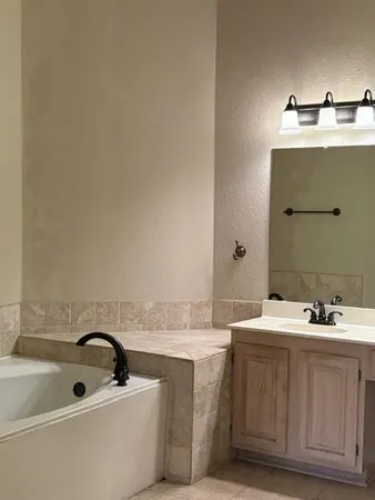 a bathroom with a sink and a bathtub