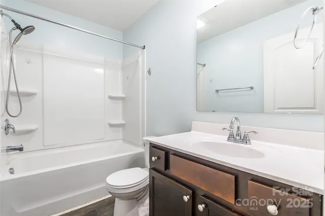 a bathroom with a sink a toilet and a bathtub