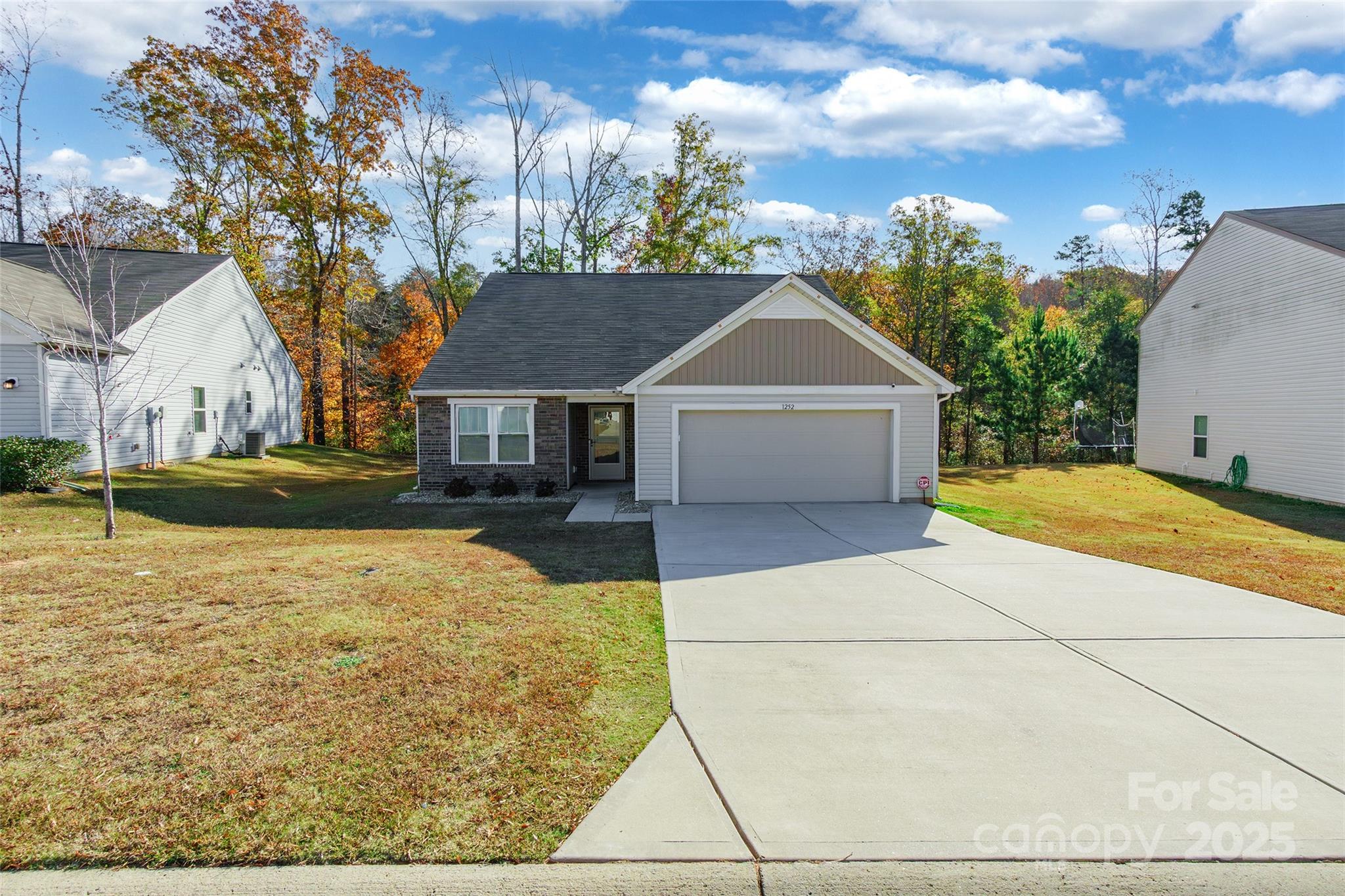 1252 Whitehall Hill Road York, SC 29745 - Photo 24 of 24 a front view of a house with a yard and trees
