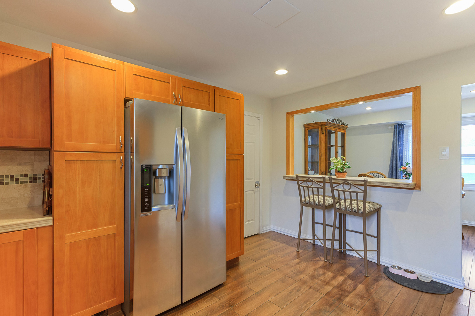 524 Spruce Road Bolingbrook, IL 60440 - Photo 14 of 33 a view of a refrigerator in kitchen and wooden floor