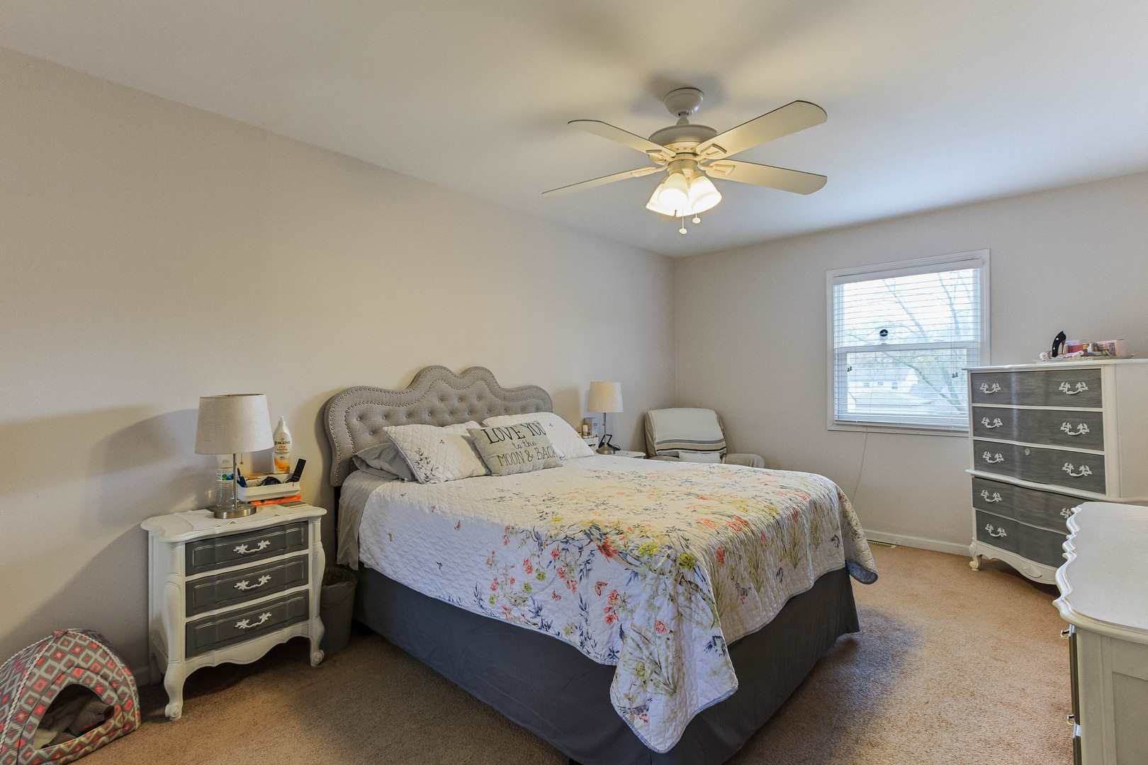 524 Spruce Road Bolingbrook, IL 60440 - Photo 17 of 33 a bedroom with a bed and a chandelier
