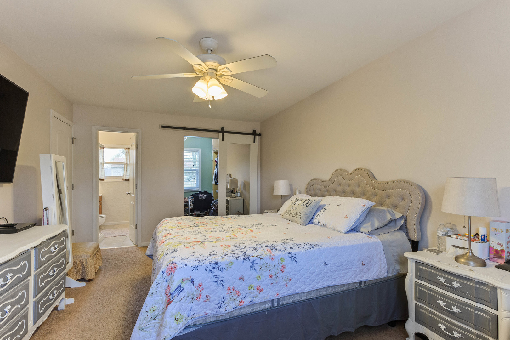 524 Spruce Road Bolingbrook, IL 60440 - Photo 18 of 33 a bedroom with a bed and a chandelier