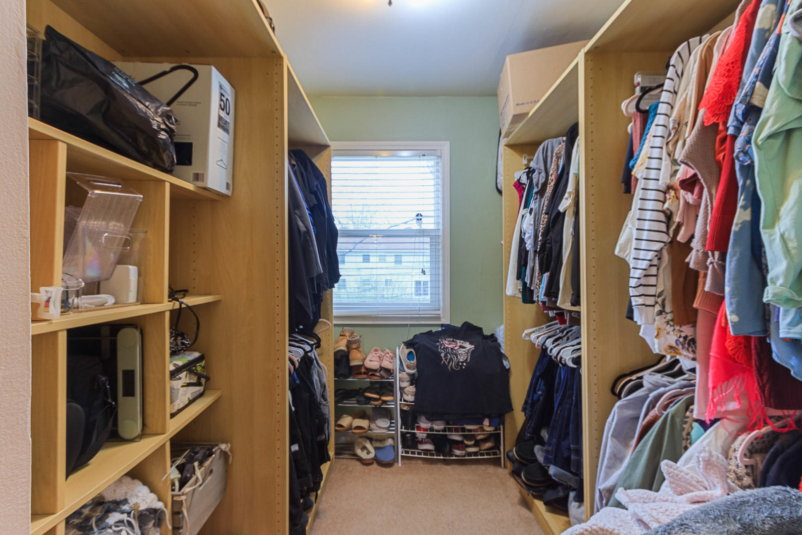 524 Spruce Road Bolingbrook, IL 60440 - Photo 20 of 33 a view of walk in closet with clothes and shoes