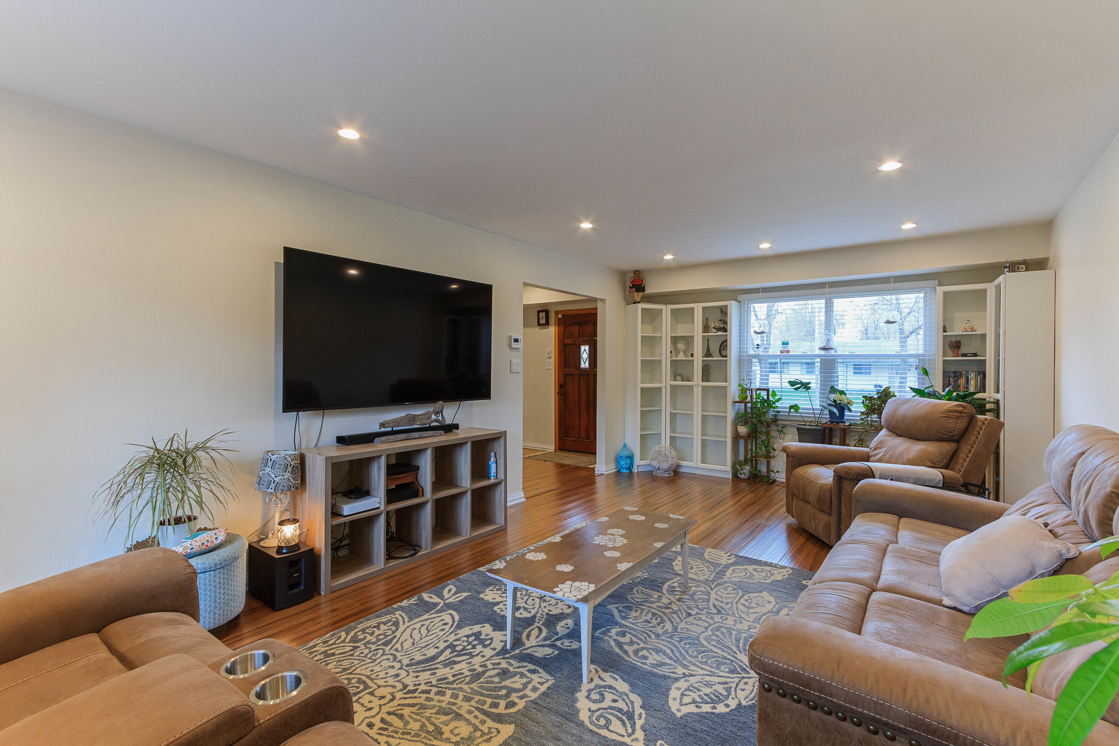 524 Spruce Road Bolingbrook, IL 60440 - Photo 8 of 33 a living room with furniture and a flat screen tv
