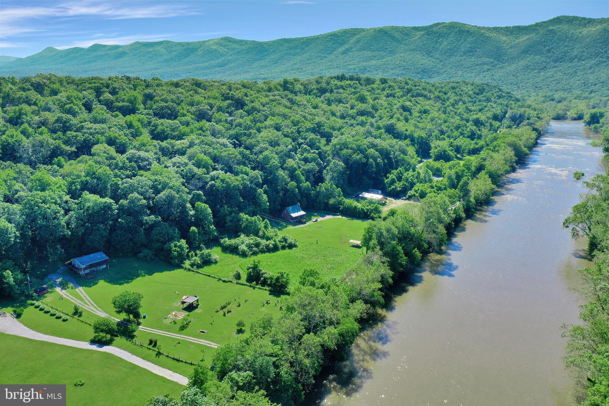 1125 Island Ford Road Rileyville, VA 22650 - Photo 2 of 70 a view of a lush green hillside and houses