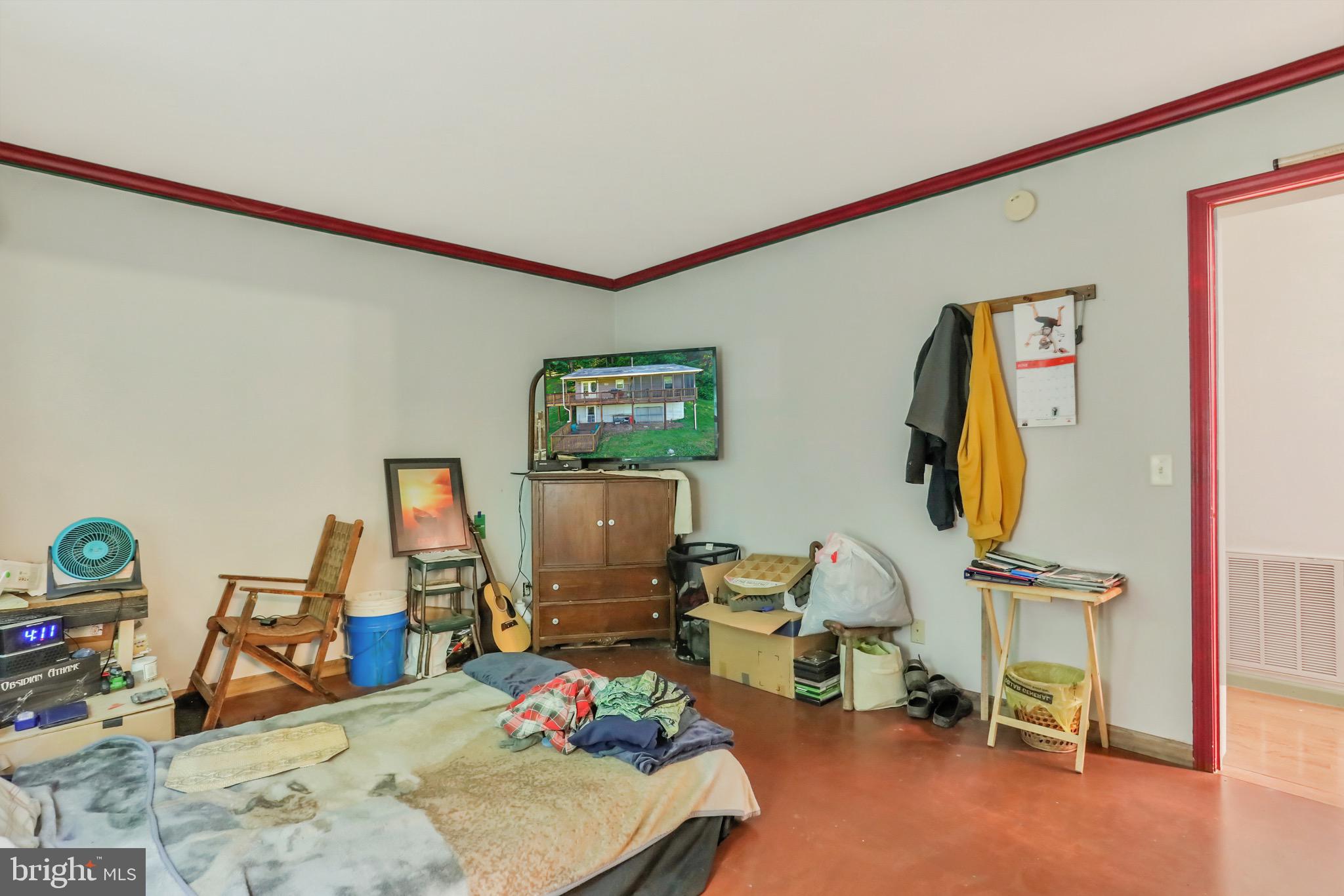 1125 Island Ford Road Rileyville, VA 22650 - Photo 21 of 70 a room with gym equipment and a flat screen tv