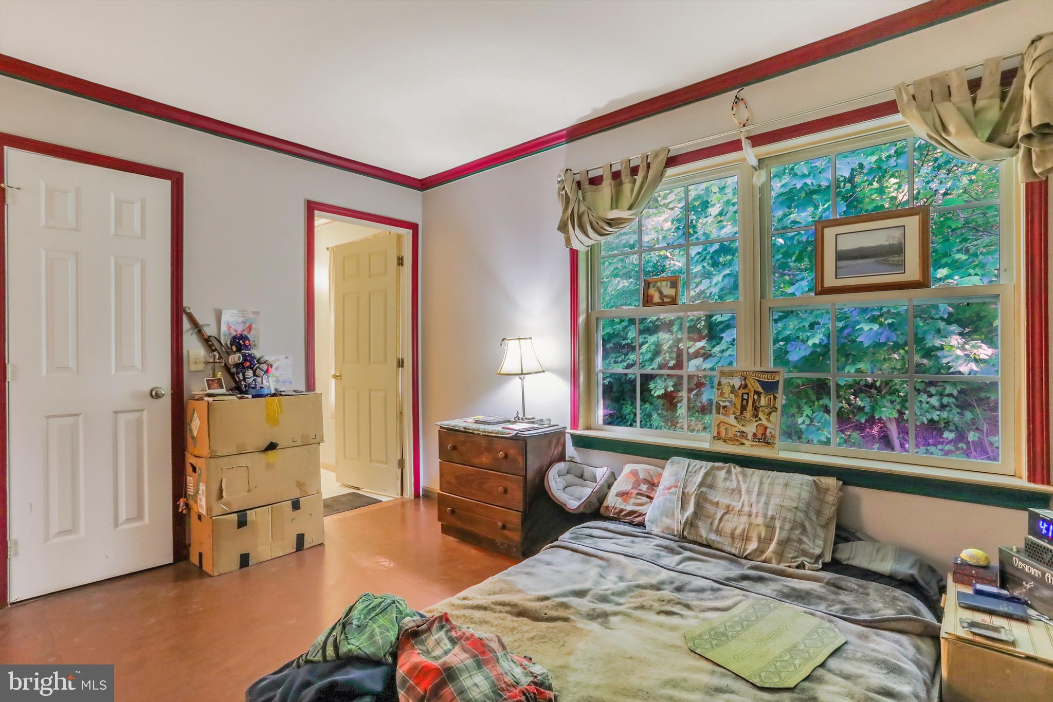 1125 Island Ford Road Rileyville, VA 22650 - Photo 22 of 70 a bedroom with a bed and wooden floor