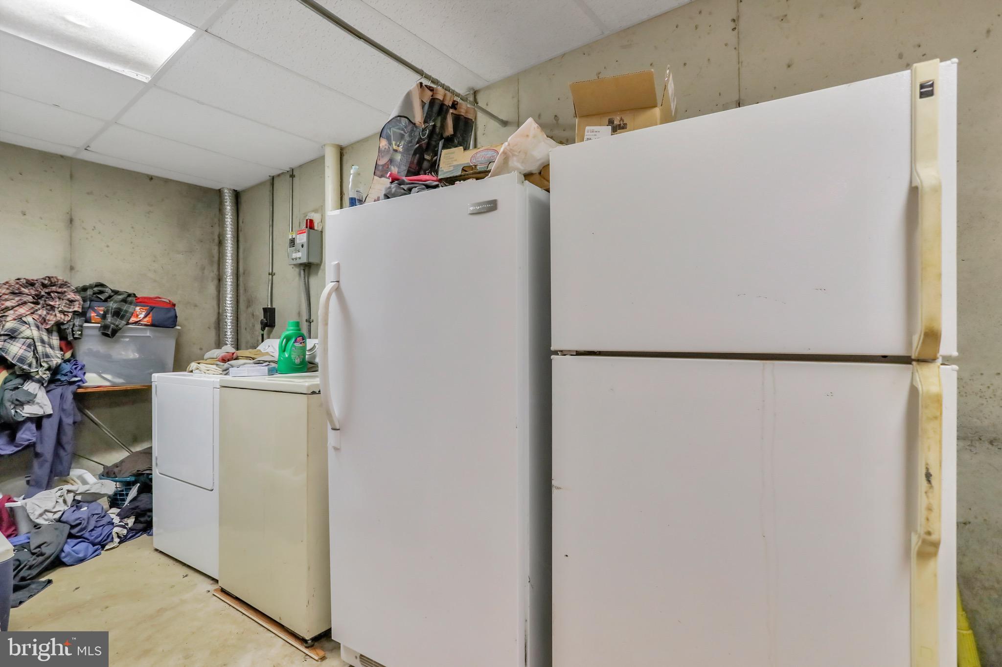 1125 Island Ford Road Rileyville, VA 22650 - Photo 25 of 70 a white refrigerator freezer sitting inside of a kitchen