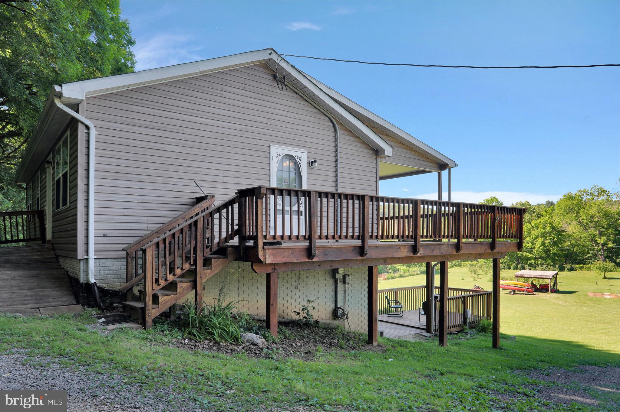 1125 Island Ford Road Rileyville, VA 22650 - Photo 35 of 70 a view of a house with backyard and porch