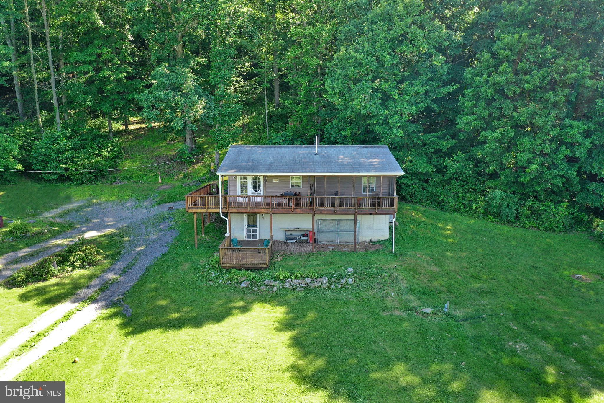 1125 Island Ford Road Rileyville, VA 22650 - Photo 63 of 70 a aerial view of a house with a yard table and chairs