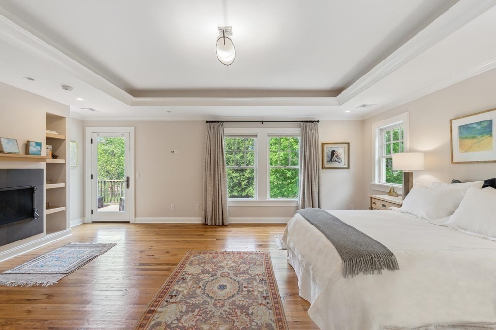 2 Decatur Lane Wayland, MA 01778 - Photo 15 of 35 a spacious bedroom with a large bed and a window