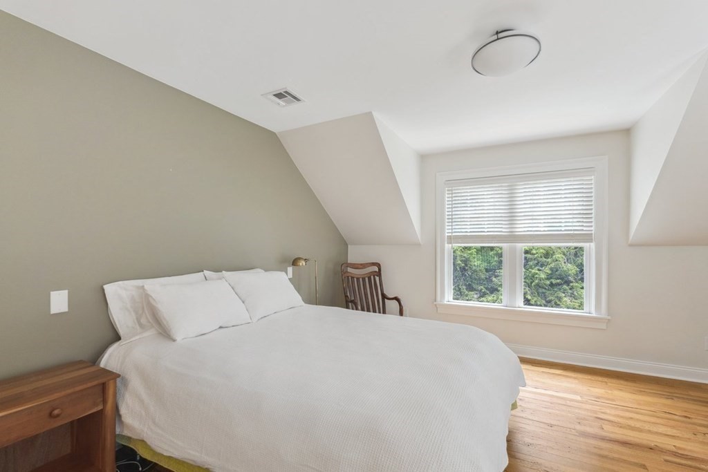 2 Decatur Lane Wayland, MA 01778 - Photo 23 of 35 a large bed sitting in a bedroom next to a window