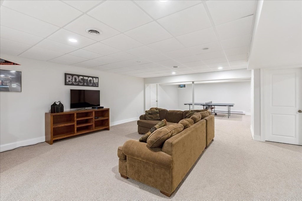 2 Decatur Lane Wayland, MA 01778 - Photo 26 of 35 a living room with furniture and a flat screen tv