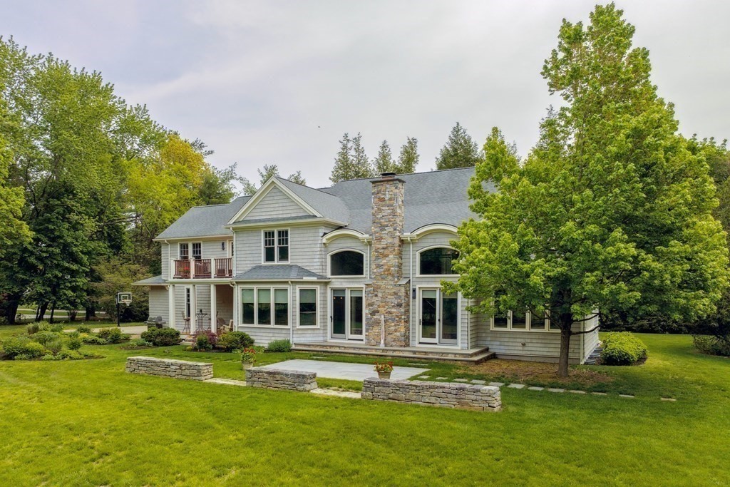 2 Decatur Lane Wayland, MA 01778 - Photo 30 of 35 a front view of a house with a garden and trees