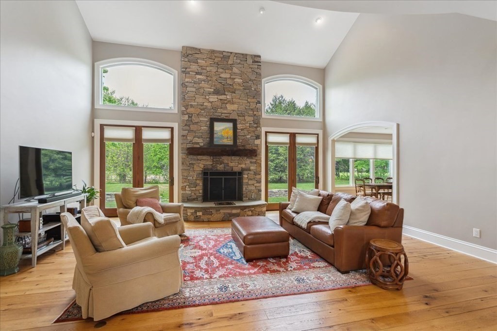 2 Decatur Lane Wayland, MA 01778 - Photo 3 of 35 a living room with furniture large window and a fireplace