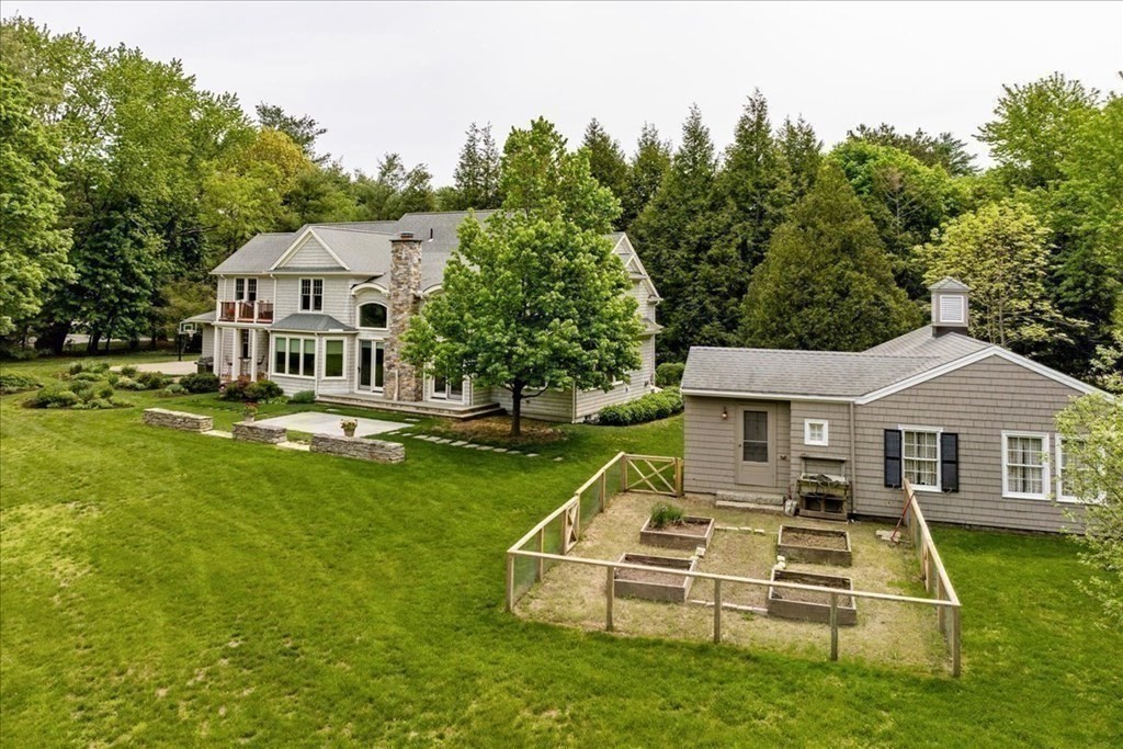 2 Decatur Lane Wayland, MA 01778 - Photo 31 of 35 a front view of a house with a yard table and chairs