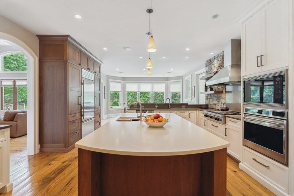 2 Decatur Lane Wayland, MA 01778 - Photo 7 of 35 a kitchen with stainless steel appliances a sink stove and refrigerator