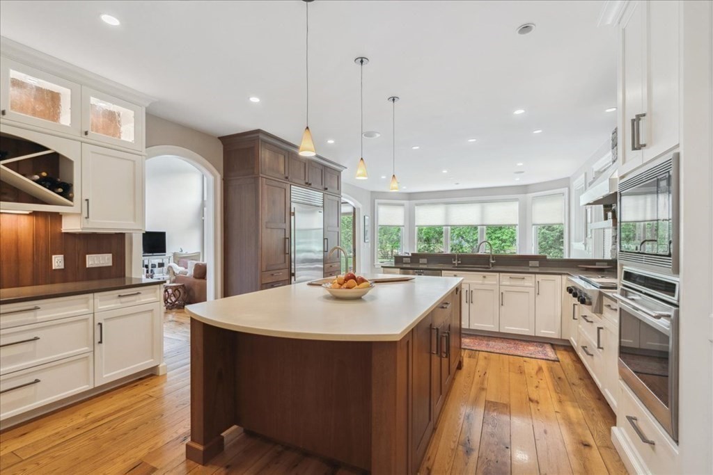 2 Decatur Lane Wayland, MA 01778 - Photo 9 of 35 a kitchen with stainless steel appliances granite countertop a sink stove and refrigerator