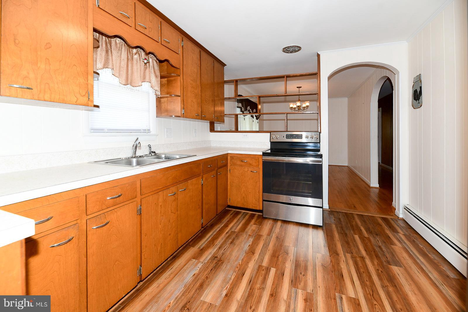40480 Parsons Mill Road Leonardtown, MD 20650 - Photo 11 of 48 a kitchen with stainless steel appliances granite countertop a refrigerator and a sink